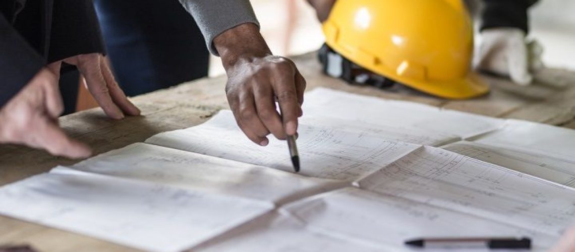 Housing projects - blueprint - finger pointing